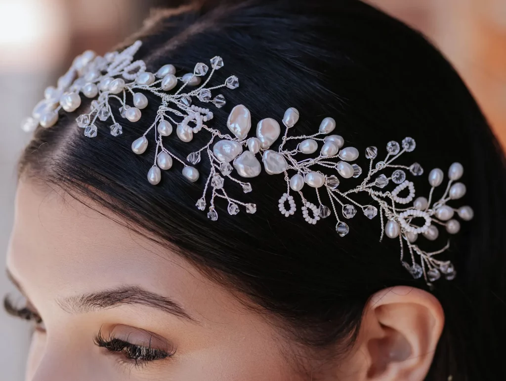 Ariana bridal hair vine with freshwater pearls, crystal beads and silver vine detailing worn in a wedding hairstyle